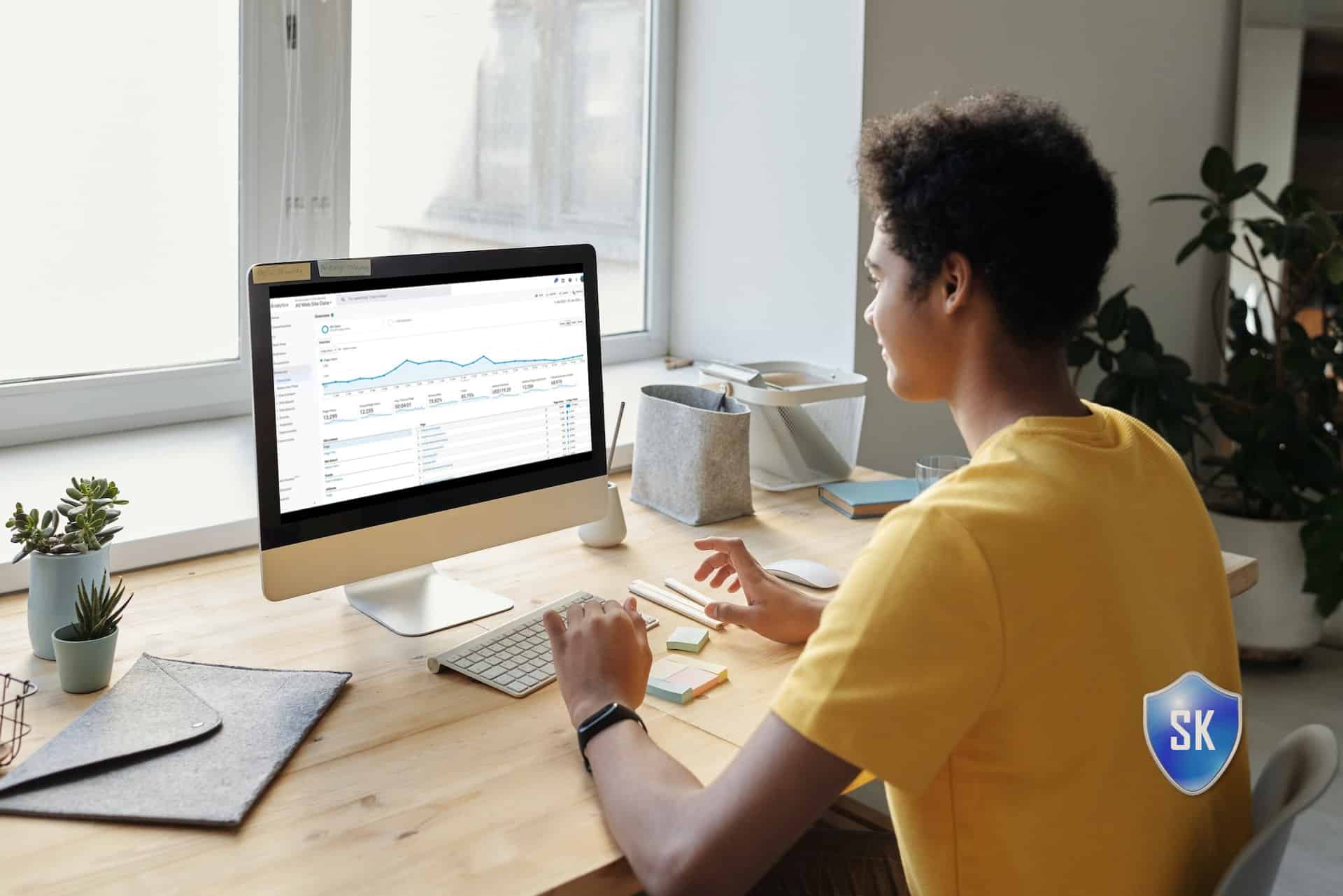 man on pc reading analytics